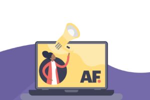 Image of laptop with woman holding megaphone for a blog about Social AF's Team Leaders