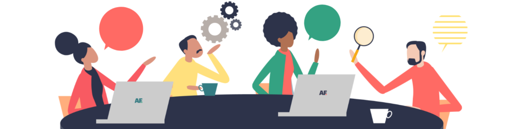 An image showing people sitting around their laptops and talking about why tone of voice in social media moderation is important