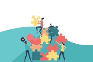 Vector illustration of puzzle blocks and building team for a blog about Building a Positive Remote Team Culture
